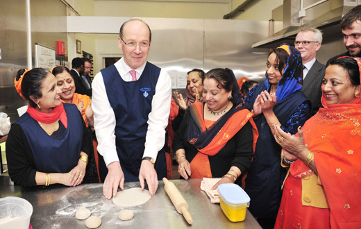 Swinney in a pinny: finance minister John Swinney opens the Punjabi community restaurant in Leith Swinney in a pinny: finance minister John Swinney opens the Punjabi community restaurant in Leith
