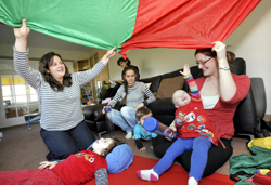 Special needs children enjoy the fun of a nursery school specially equipped for their needs