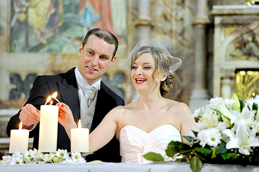 Dee and Rob lighting marriage candles
