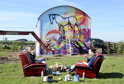 Artists Will Barras and Amy Winstanley taking a break from painting at East Knockbrex Farm, near Newton Stewart